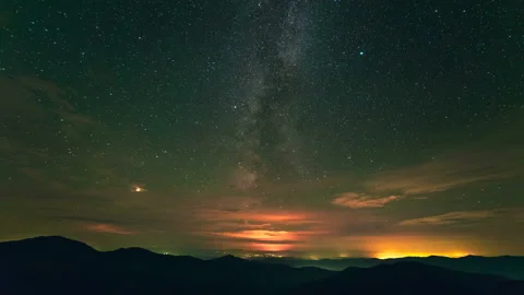 The cloud stream above mountains on the starry sky background. time lapse Stock Footage 95209868