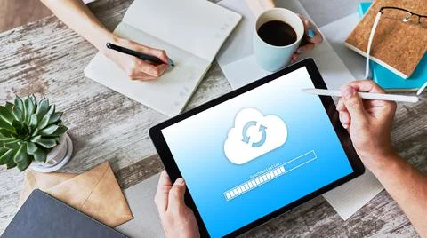 Cloud synchronization progress bar on tablet screen. Data storage and protection Stock Photos
