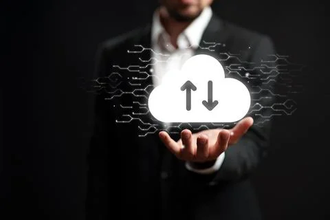 Cloud technology and data transfer concept with a person holding a cloud icon Stock Photos