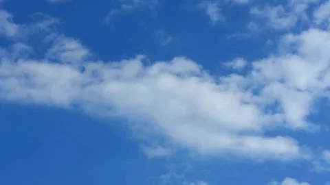 Cloud time lapse. Blue sky white clouds. Puffy fluffy white clouds. Stock Footage 141808063