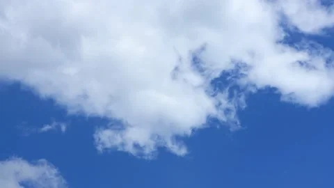 Cloud time lapse. Blue sky white clouds. Puffy fluffy white clouds. Stock Footage 141808311