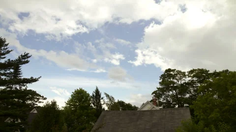 Cloud time lapse over house and trees Stock Footage 28746129