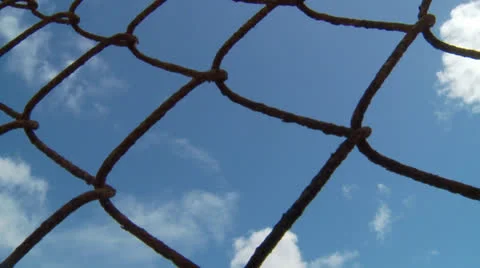 Cloud Time lapse Through Fence 스톡 동영상 25853243