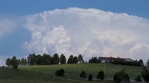 Cloud timelapse behind farm house Stock Footage 78958144