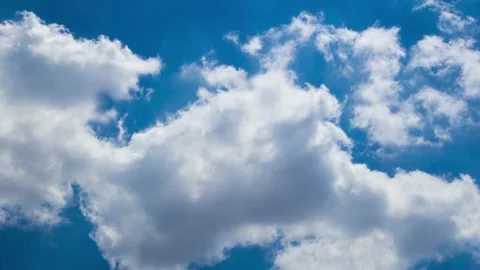 Cloud Timelapse on Blue Sky Background. Fluffy White Clouds Flying on Sky. Stock Footage 136775030