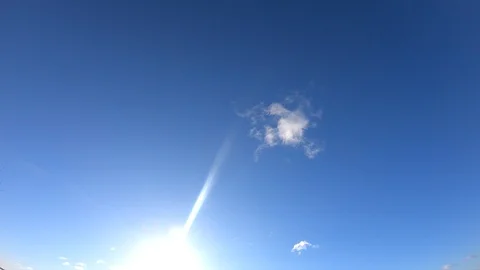 The Cloud timelapse on blue sky. Clouds and sun timelapse. Stock Footage 103396379