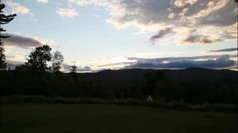 Cloud timelapse of a darkening sky with a teepee in the foregroud, 4K Stock Footage 65497789