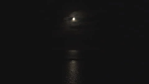 Cloud Timelapse - moon over the sea  Video stock 244724453