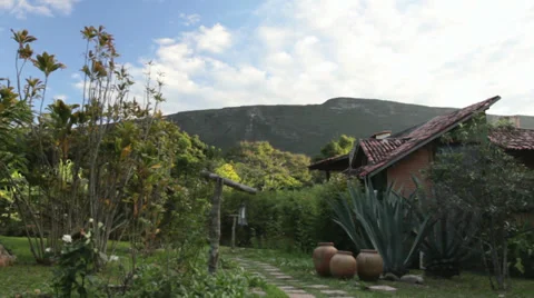Cloud Timelapse - Mountains and house Stock Footage 27356155
