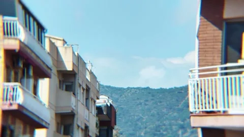 Cloud Timelapse Over City with Mountain Between Buildings Video stock 331298635