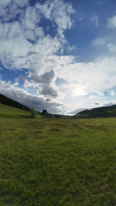 Cloud Timelapse Over Green Field Under Dramatic Moving Sky Video stock 335328792