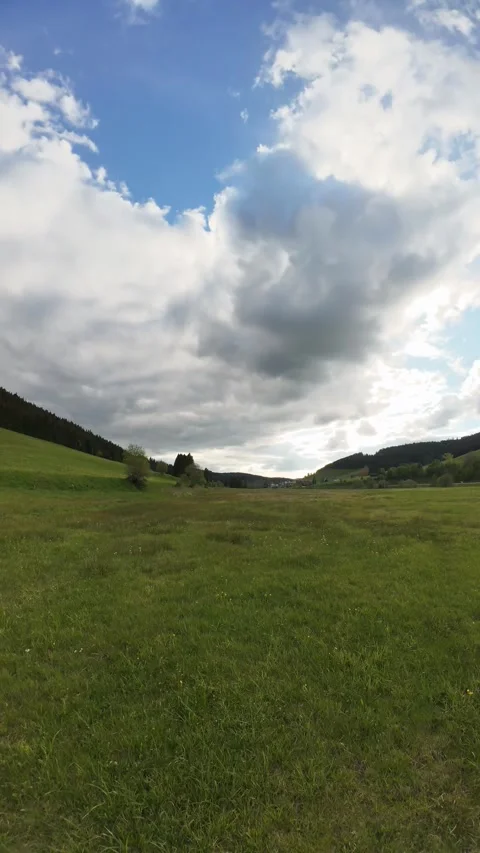 Cloud Timelapse Over Green Field Under Dramatic Moving Sky Video stock 335328793