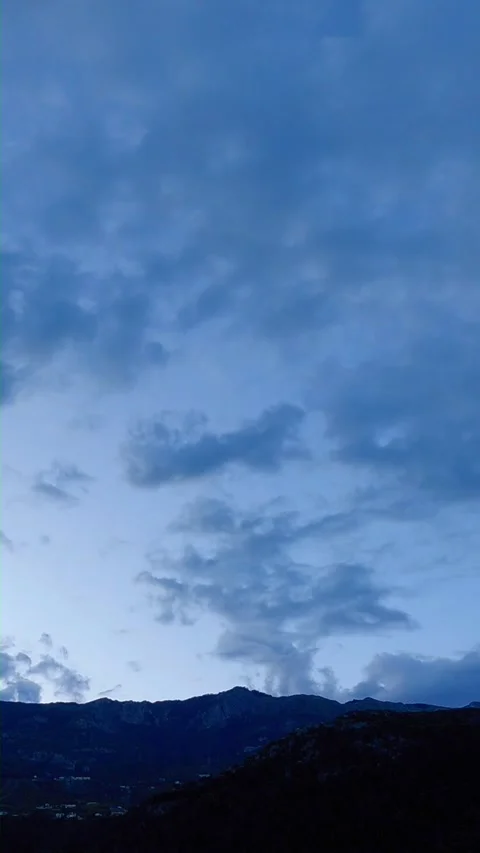 Cloud timelapse over mountain silhouette Stock Footage 341116175