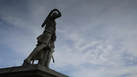 Cloud  timelapse over a statue in Ireland Stock Footage 93703924