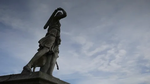 Cloud  timelapse over a statue in Ireland Stock Footage 93705099