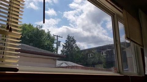 Cloud timelapse through kitchen window Stock Footage 105557932