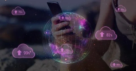 Cloud upload icon and spinning globe against mid section of woman using Stock Photos