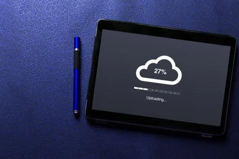 Cloud uploading concept on tablet screen with blue pen on blue pattern textured  Stock Photos