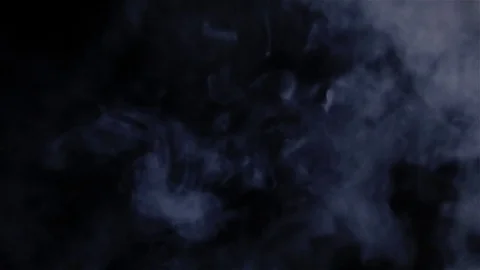 A cloud of vapor from an electronic cigarette on a black background. Stock Footage 72414921