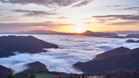 Cloud waves in mountain valley, cloud inversion in mountain landscape at sunrise Stock Footage 221015411