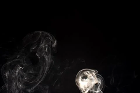 Cloud of white smoke on black background Stock Photos