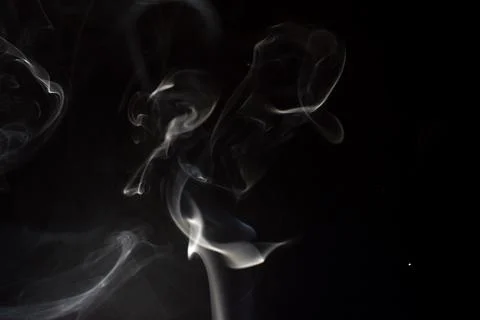 Cloud of white smoke on black background Stock Photos