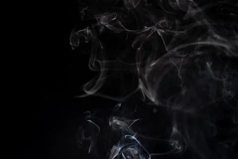Cloud of white smoke on black background Stock Photos