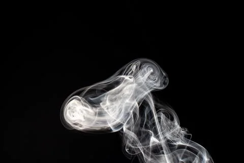 Cloud of white smoke on black background Stock Photos