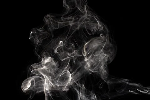 Cloud of white smoke on black background Stock Photos