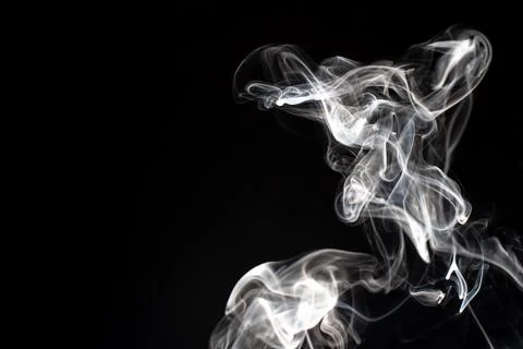 Cloud of white smoke on black background Stock Photos