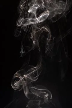 Cloud of white smoke on black background Stock Photos