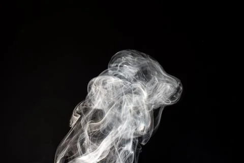 Cloud of white smoke on black background Stock Photos