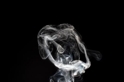 Cloud of white smoke on black background Stock Photos
