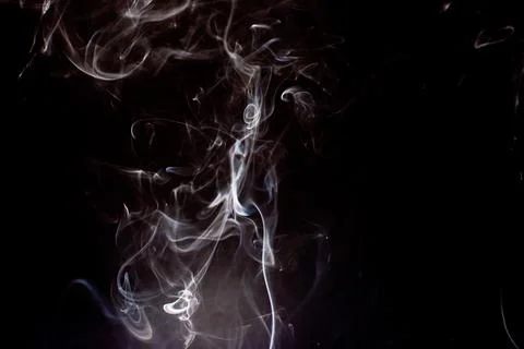 Cloud of white smoke on black background 写真素材