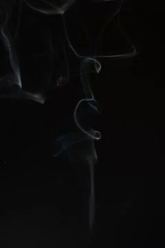 Cloud of white smoke on black background Stock Photos