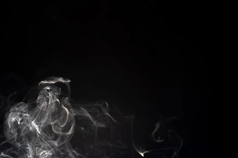 Cloud of white smoke on black background Stock Photos