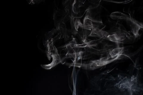 Cloud of white smoke on black background Stock Photos