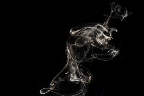 Cloud of white smoke on black background 写真素材