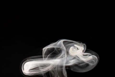 Cloud of white smoke on black background 写真素材