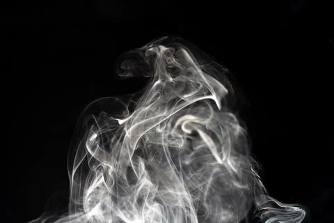 Cloud of white smoke on black background Stock Photos