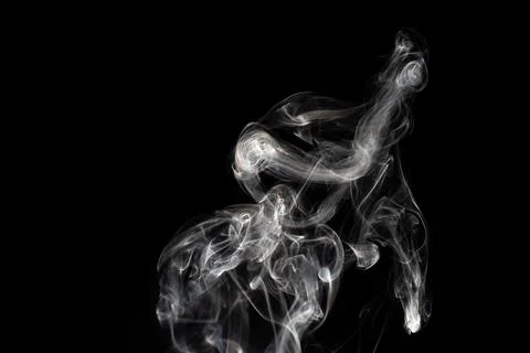 Cloud of white smoke on black background Stock Photos