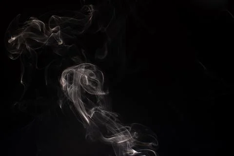 Cloud of white smoke on black background Stock Photos