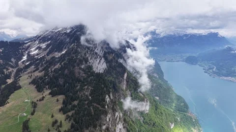 Cloud wrapped alpine ridge Stock Footage 344848929
