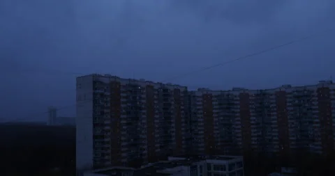Clouded evening sky, somber Eastern European apartment scene, heavy autumn rain Stock Footage 296801887