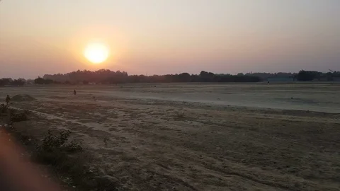 The clouded sky and sun set during a flight Видео 99075235