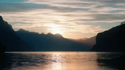 Clouded Sunset Sky Above Walensee and Alpine Mountains Vidéo 348766595