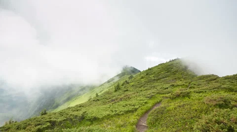 Cloudes overpassing mountain chain Stock Footage 48871315