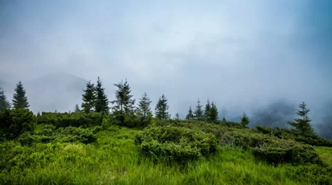 Cloudes overpassing mountain chain Stock Footage 48871364