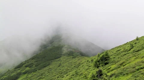 Cloudes overpassing mountain chain Stock Footage 48871415