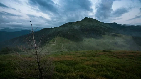 Cloudes overpassing mountain chain Stock Footage 48871467